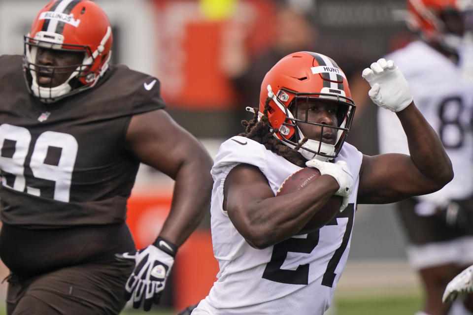 Cleveland Browns running back Kareem Hunt (27) rushes during an NFL football practice, Saturday, July 31, 2021, in Berea, Ohio. (AP Photo/Tony Dejak)