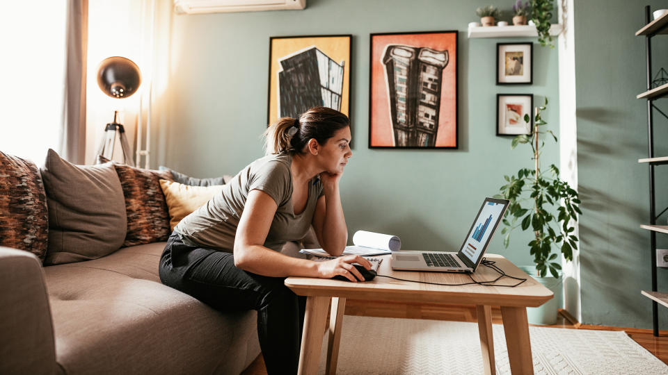 Woman working from home due to restrictive measures, lockdown and quarantine due to pandemic Coronavirus.