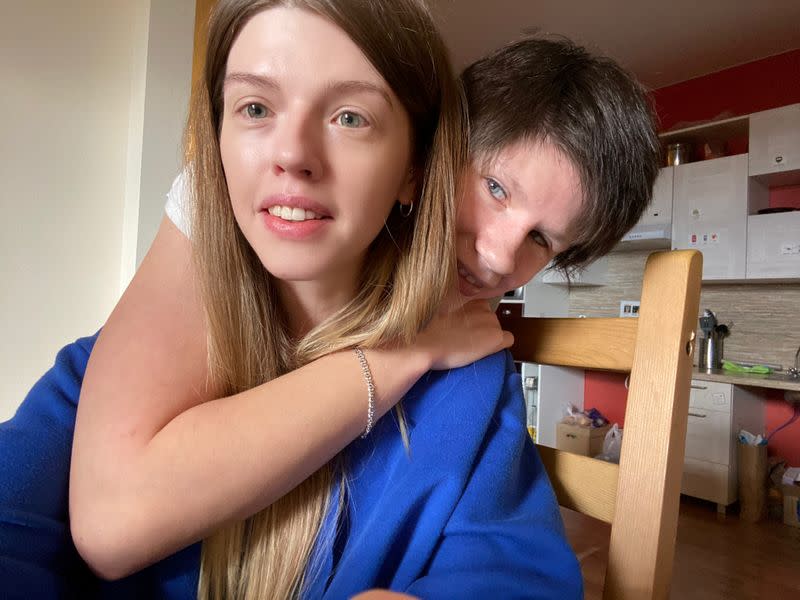 Arina Muratova, a market researcher, and Nina, a resident of Moscow's Psychiatric Hospital N.22, take a selfie at a rented apartment provided by the Life Route foundation, where they will self-isolate together in Moscow