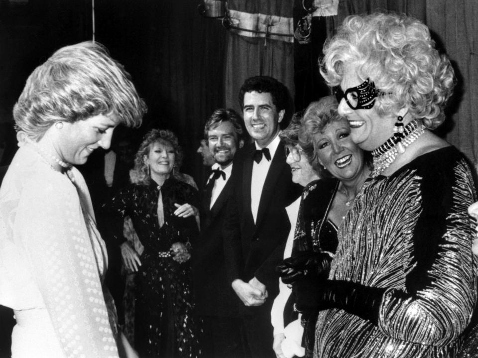 FILE - Diana, Princess of Wales, left, reacts with performer Barry Humphries as Dame Edna Everage, backstage at the Golden Jubilee concert in aid of the charity 'Birthright' at the London Palladium, Nov. 13, 1987. Tony Award-winning comedian Barry Humphries, internationally renowned for his garish stage persona Dame Edna Everage, a condescending and imperfectly-veiled snob whose evolving character has delighted audiences over seven decades, has died on Saturday, April 22, 2023, after spending several days in a Sydney hospital with complications following hip surgery, a Sydney hospital said. (PA via AP, File)
