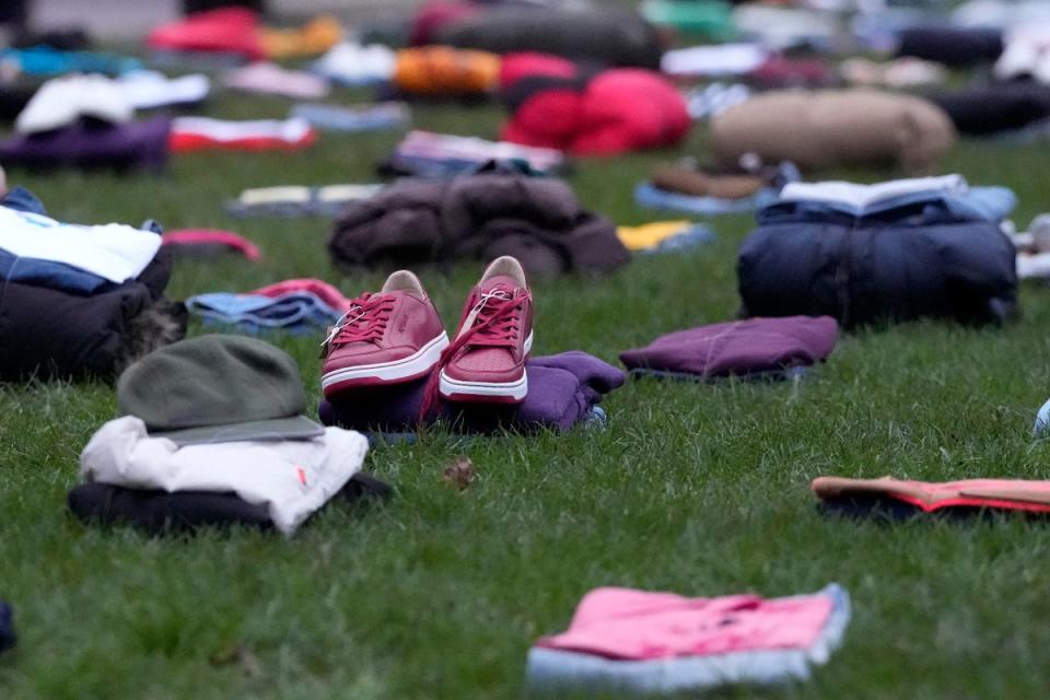 Idris Elba staged a knife crime protest with clothes for each of 247 people killed in the UK last year (AP)