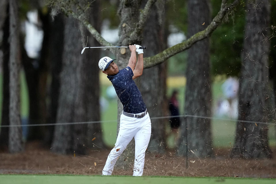 Justin Suh hits out of the rough on the 15th fairway during the first round of The Players Championship golf tournament, Thursday, March 9, 2023, in Ponte Vedra Beach, Fla. (AP Photo/Eric Gay)