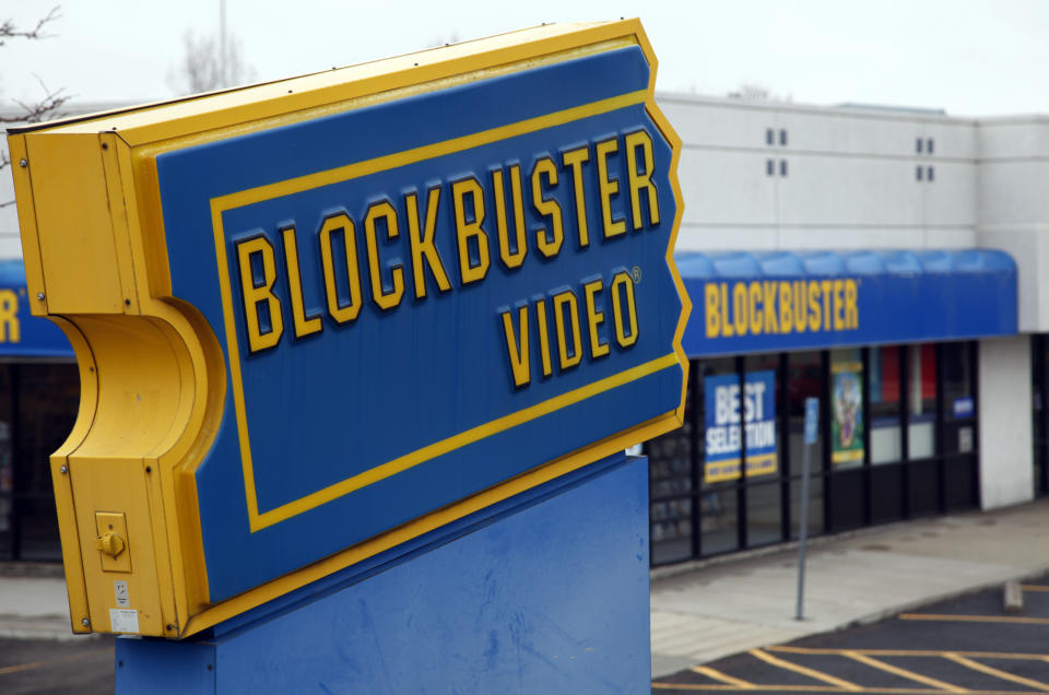 The Blockbuster movie rental store is open for business in the Denver suburb of Broomfield, Colorado April 6, 2011. Dish Network Corp won Blockbuster Inc in a bankruptcy auction for about $320 million, boosting the satellite TV provider's online features and marketing reach. Dish, the second-largest U.S. satellite TV company after DirecTV, trumped at least three other bidders, including activist investor Carl Icahn, for the one-time leader in video rentals. REUTERS/Rick Wilking (UNITED STATES - Tags: BUSINESS)