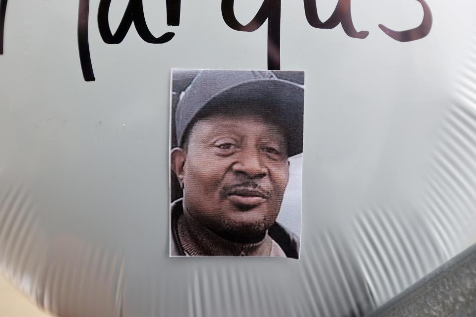 A photograph of Margus D. Morrison is show on a balloon outside the Tops Friendly Markets store in Buffalo where 10 people were killed.