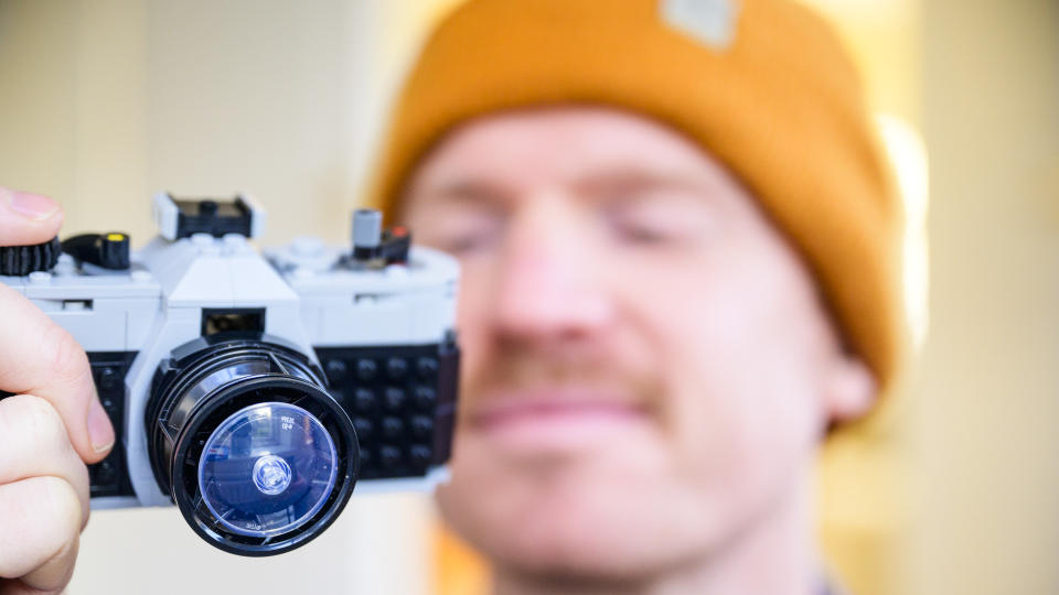 Reviewer holding the complete Lego Retro camera