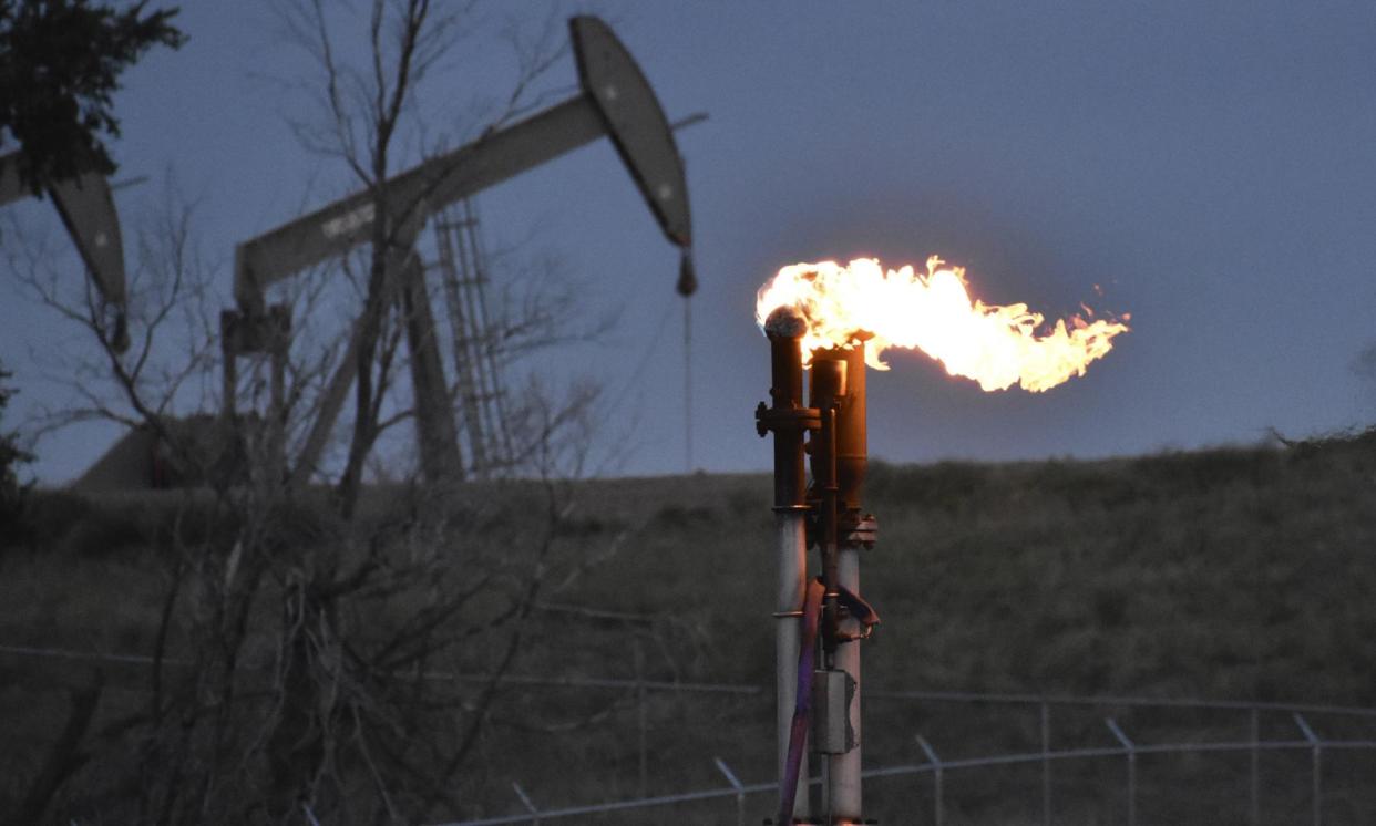 <span>A flare to burn excess methane from oil production in North Dakota. The US is now the biggest source of methane emissions from oil and gas extraction.</span><span>Photograph: Matthew Brown/AP</span>