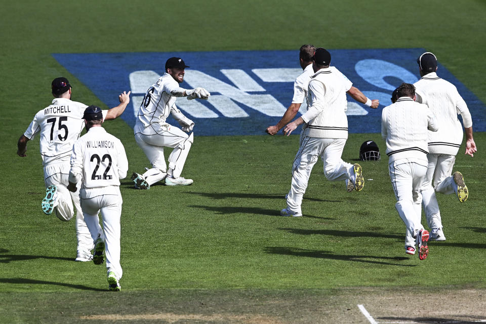 New Zealand teammates celebrate the wicket of England's James Anderson for their win by 1 run on day 5 of their cricket test match in Wellington, New Zealand, Tuesday, Feb 28, 2023. (Andrew Cornaga/Photosport via AP)