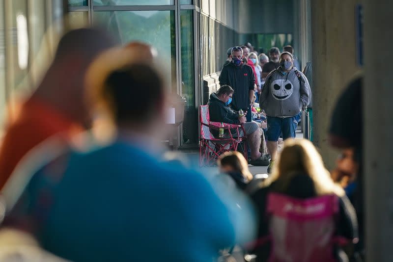 People wait outside Kentucky Career Center in Frankfort