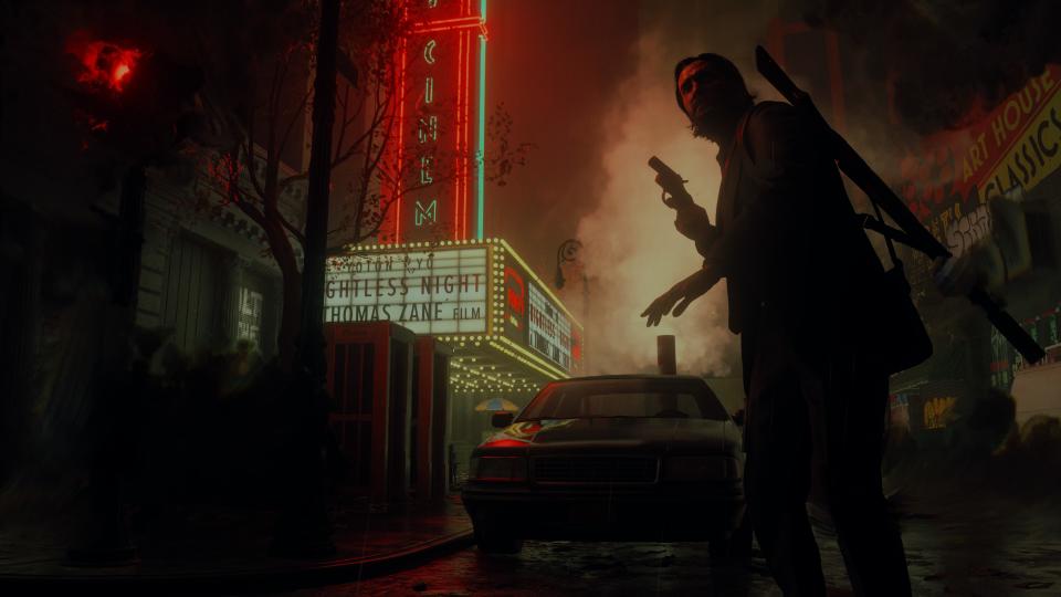 Alan Wake 2 hero shot showing Alan Wake exploring the dark place outside of a cinema
