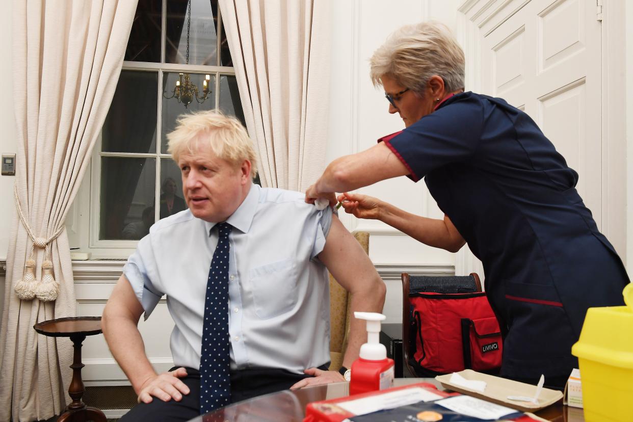 Boris Johnson receiving a flu vaccine in October last year. One of his top coronavirus advisers has said the prime minister shouldn't be first to receive a COVID-19 vaccine. (Jeremy Selwyn/pool/AFP via Getty Images)      Picture Jeremy Selwyn  Evening Standard (Photo by Jeremy Selwyn / POOL / AFP) (Photo by JEREMY SELWYN/POOL/AFP via Getty Images)