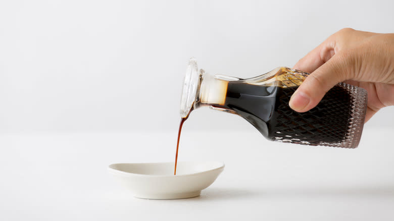 pouring worcestershire sauce into bowl