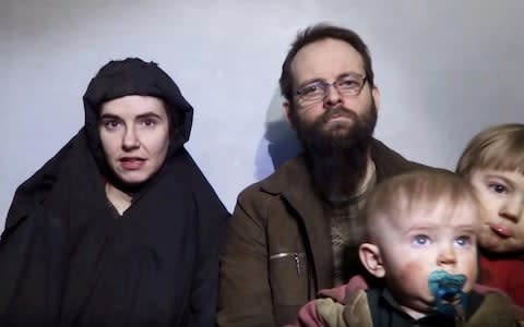 Caitlin Coleman, Joshua Boyle and two of their children during their time in captivity - Credit: Reuters