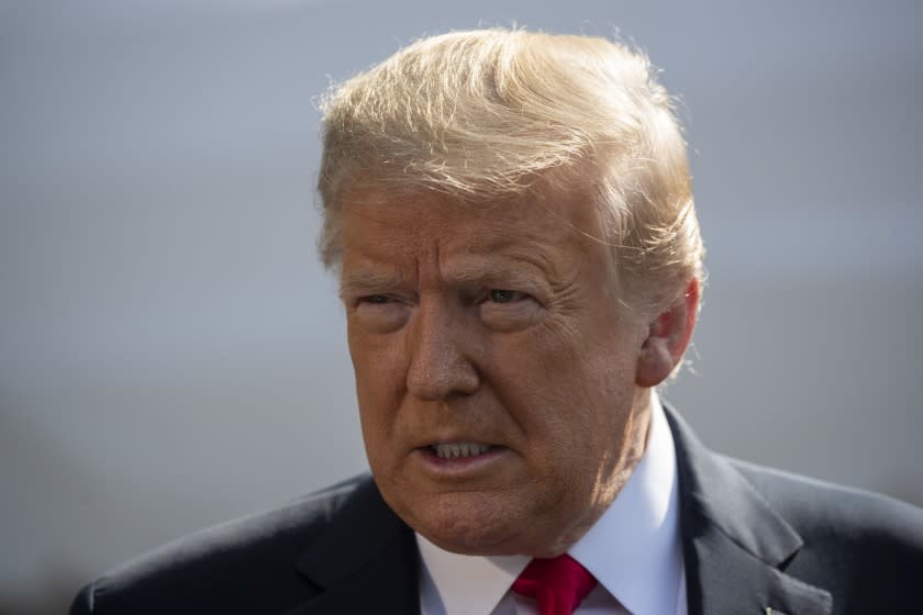 FILE - In this June 23, 2020, file photo President Donald Trump speaks with reporters before departing on Marine One on the South Lawn of the White House in Washington. Trump last week publicly predicted without evidence that the 2020 presidential election would be "the most corrupt election in the history of our country." (AP Photo/Alex Brandon, File)