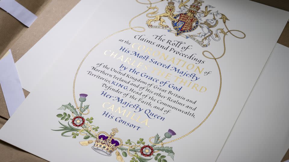 The frontispiece created by heraldic artist Timothy Noad on display at Shepherds Bookbinders, London. - Aaron Chown/Press Association/AP