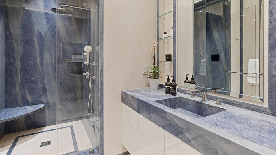 A marble-clad bathroom - Credit: Photo: Anthony Barcelo/Compass