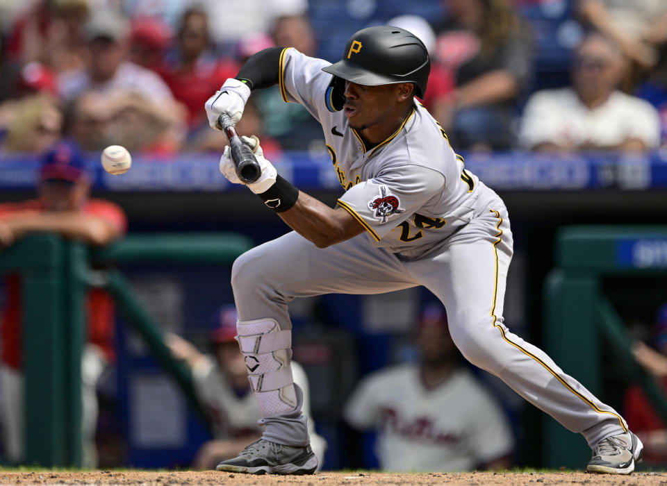 Pittsburgh Pirates' Greg Allen hits a sacrifice bunt off Philadelphia Phillies starting pitcher Noah Syndergaard to score Tucupita Marcano during the fourth inning of a baseball game, Sunday, Aug. 28, 2022, in Philadelphia. (AP Photo/Derik Hamilton)