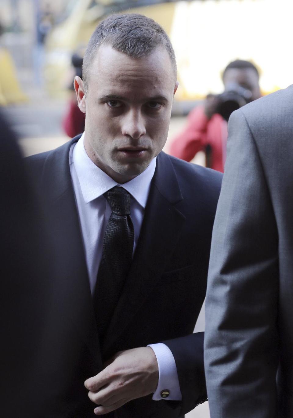 Oscar Pistorius at the high court in Pretoria, South Africa, Thursday, May 8, 2014. Pistorius' defense lawyer has called an anesthetist to testify at the runner's murder trial. Pistorius is charged with murder for the shooting death of his girlfriend, Reeva Steenkamp, on Valentines Day in 2013. (AP Photo/Themba Hadebe)