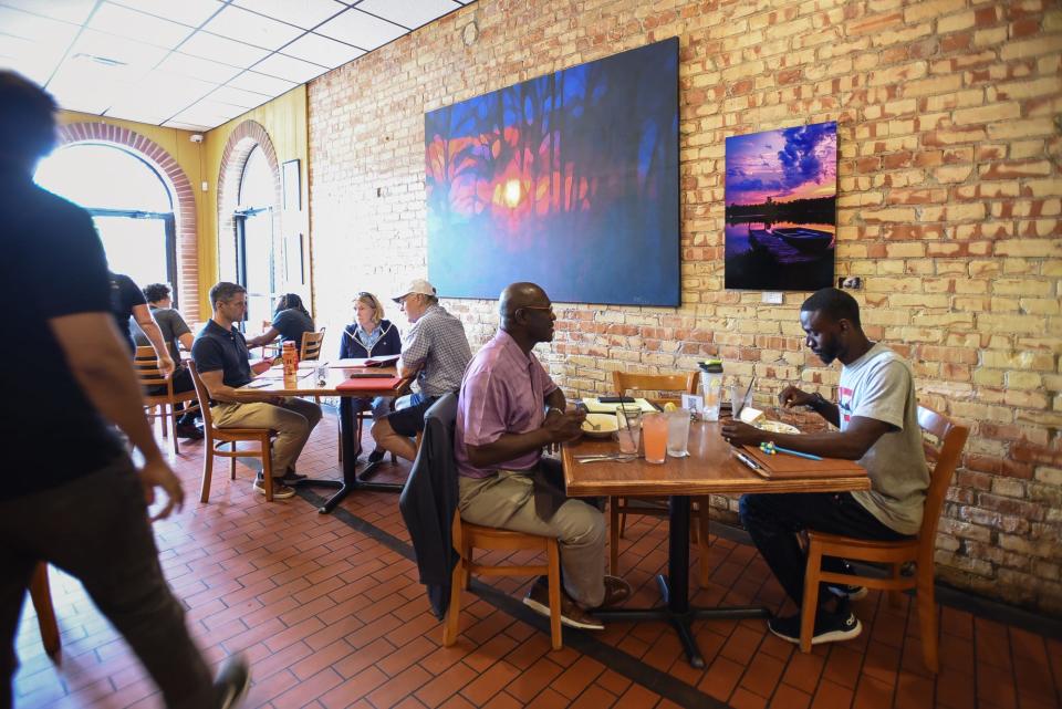 Diners eat lunch at The Soup Spoon Cafe in Lansing, Monday, Aug. 14, 2023.