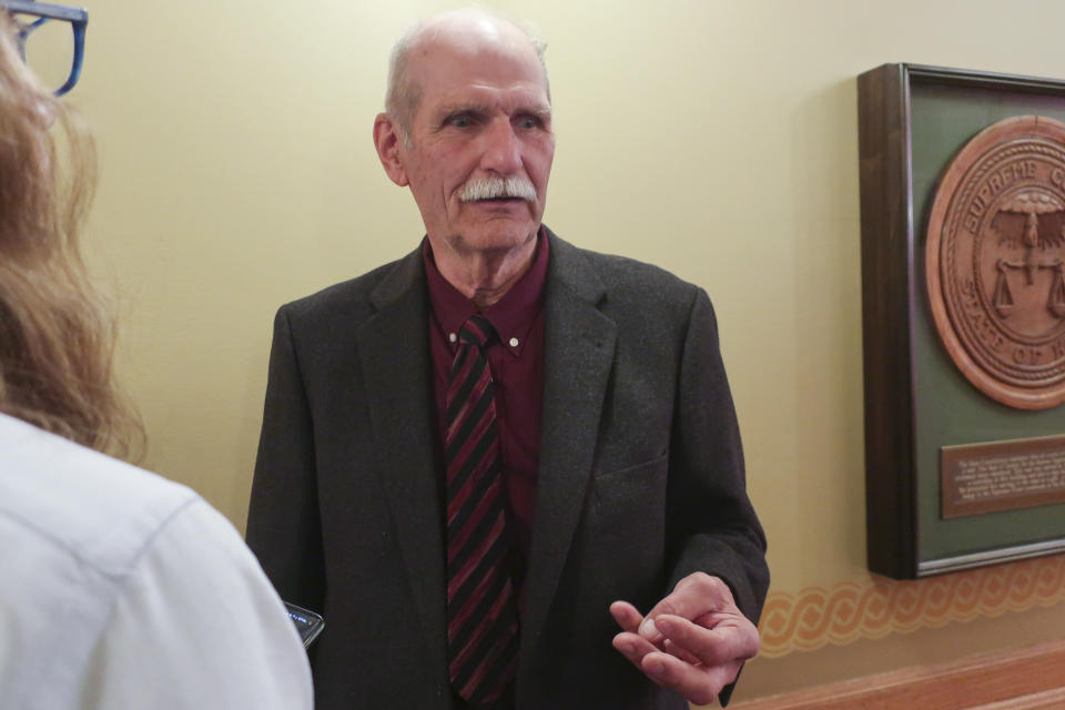 Bill Pannbacker, a Washington County farmer and rancher, talks to reporters after a briefing on a December oil spill from the Keystone pipeline system for two Kansas House committees, Tuesday, March 14, 2023, at the Statehouse in Topeka, Kan. The oil spill soaked part of one of Pannbacker's pastures and now he believes he might not be able to use it again for several years. (AP Photo/John Hanna)