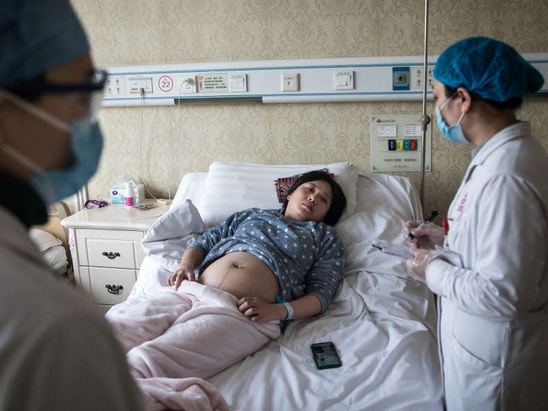WUHAN, CHINA - FEBRUARY 19: A doctor examines a pregnant woman in a private obstetric hospital on February 19, 2020 in Wuhan, Hubei, China. Due to the shortage of medical resources in Wuhan, many pregnant women choose to give birth in private hospitals. World Health Organization (WHO) Director-General Tedros Adhanom Ghebreyesus said on January 30 that the novel coronavirus outbreak has become a Public Health Emergency of International Concern (PHEIC). (Photo by Getty Images)