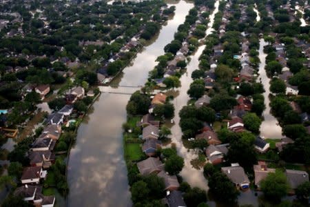 FILE PHOTO: Houses are seen partially submerged in flood waters caused by Tropical Storm Harvey in Northwest Houston, Texas, U.S., August 30, 2017.REUTERS/Adrees Latif/File Photo