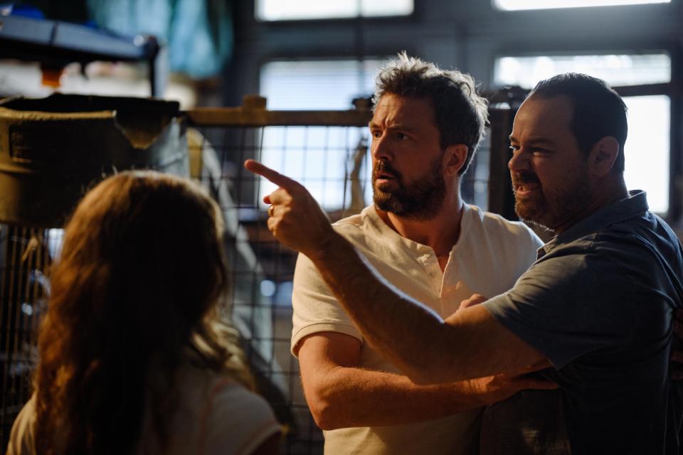 Brad (Darren McMullen) holds back a raging Steve (Danny Dyer) when he discovers Mia (Matia Marks) and Jet (Richie Morris) together. Heat (Channel 5)