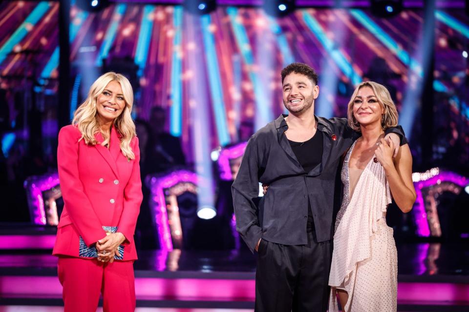 adam and luba smile as they talk to tess on strictly come dancing 2023