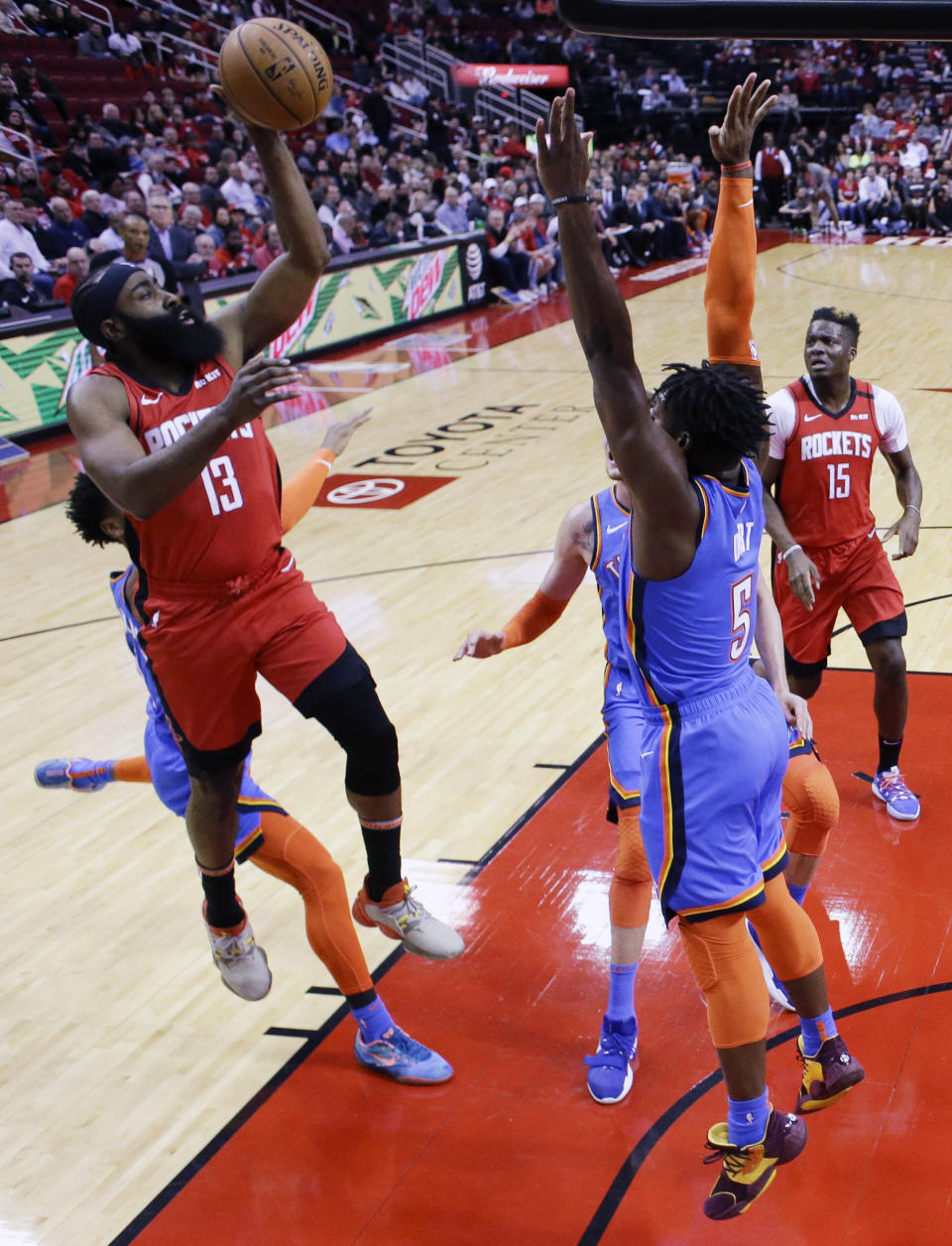 Houston Rockets guard James Harden (13) shoots as Oklahoma City Thunder guard Luguentz Dort defends during the first half of an NBA basketball game, Monday, Jan. 20, 2020, in Houston. (AP Photo/Eric Christian Smith)