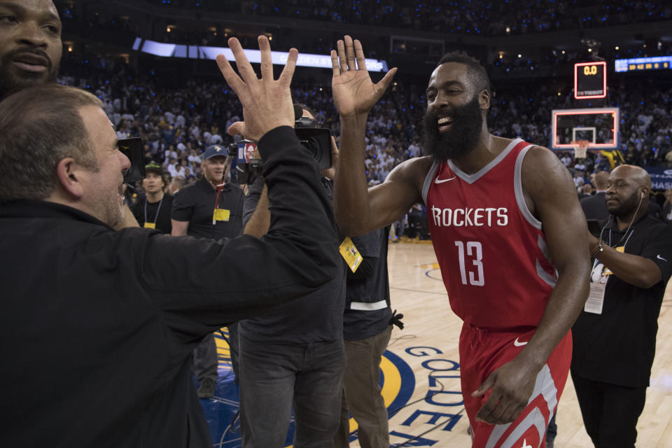 October 17, 2017; Oakland, CA, USA; Houston Rockets owner Tilman Fertitta (left) celebrates with guard James Harden (13) after the game against the Golden State Warriors at Oracle Arena. The Rockets defeated the Warriors 122-121. Mandatory Credit: Kyle Terada-USA TODAY Sports