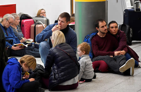 Passengers wait in the South Terminal building at Gatwick Airport, after the airport reopened to flights following its forced closure because of drone activity, in Gatwick, Britain, December 21, 2018. REUTERS/Toby Melville