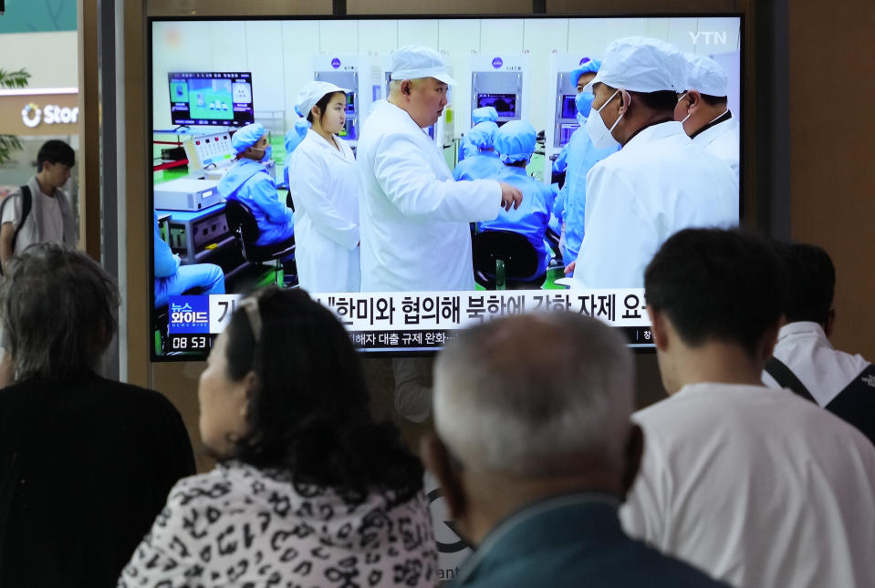 A TV screen shows a file image of North Korean leader Kim Jong Un, third from left, during a news program at the Seoul Railway Station in Seoul, South Korea, Monday, May 29, 2023. Japan's coast guard said North Korea has notified it that it plans to launch a satellite in coming days. (AP Photo/Ahn Young-joon)