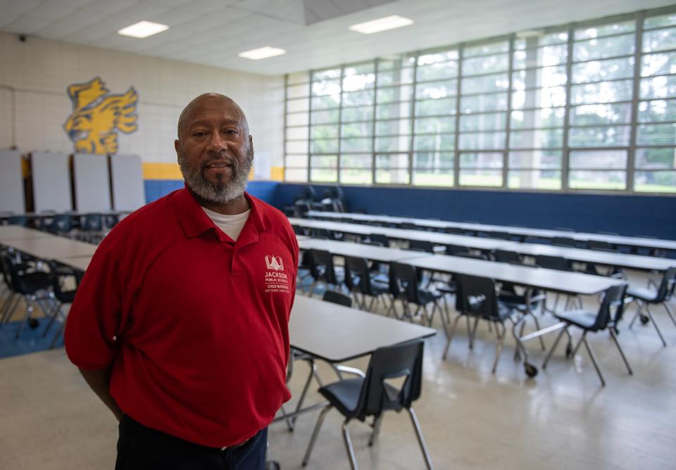 Ronney Mabry, cafeteria manager, poses for a photo inside the cafeteria at Wingfield High School in Jackson on Tuesday, May 14, 2024. "I love what I do. I love feeding kids," said Mabry, who plans to find another cafeteria position with JPS.