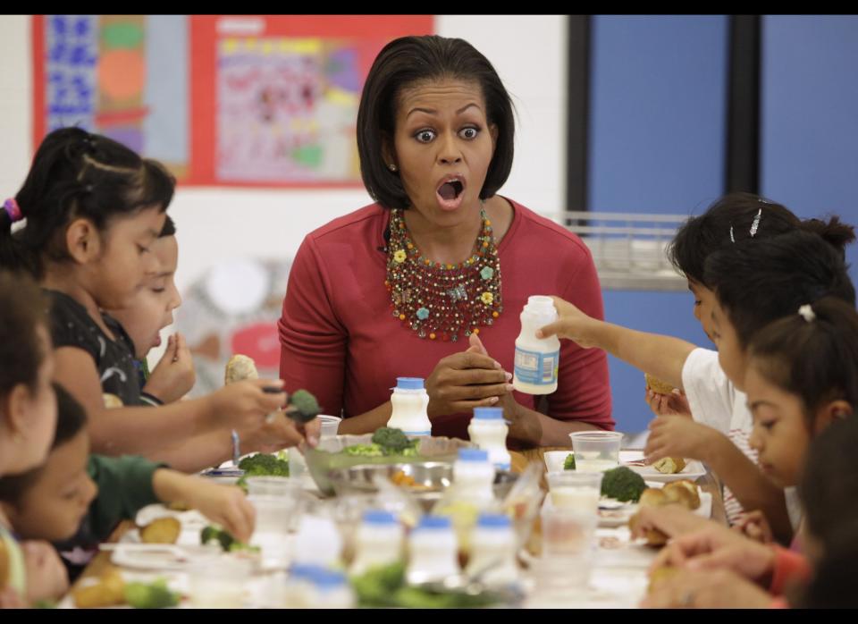 US First Lady Michelle Obama joins children during their lunch at New Hampshire Elementary School in Silver Spring, Maryland on May 19, 2010. AFP PHOTO/YURI GRIPAS (Photo credit should read YURI GRIPAS/AFP/Getty Images)