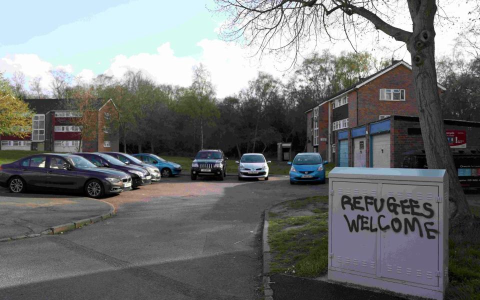 Graffiti near the scene now reads 'Refugees Welcome' - Credit: Neil Hall /REuters