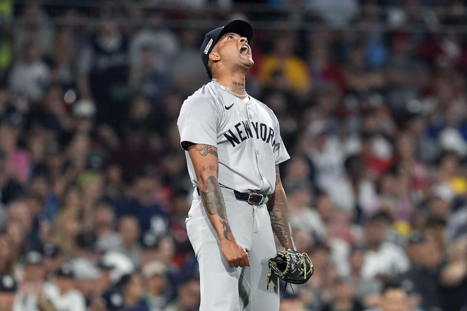 New York Yankees starting pitcher Luis Gil reacts after a groundout by Boston Red Sox's Masataka Yoshida to retire the side during the fifth inning of a baseball game, Friday, June 14, 2024, in Boston. (AP Photo/Michael Dwyer)