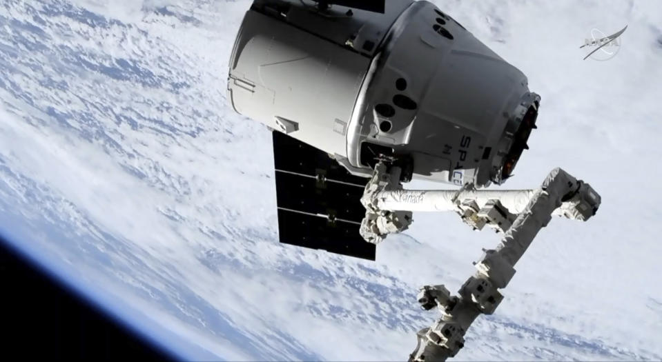 In this image taken from NASA Television, a SpaceX shipment prepares to arrive at the International Space Station following a weekend launch, Monday, May 6, 2019. The Dragon capsule reached the orbiting complex Monday, delivering 5,500 pounds (2,500 kilograms) of equipment and experiments. (NASA TV via AP)