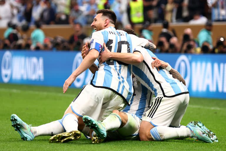 LUSAIL CITY, QATAR - DECEMBER 18:   Angel Di Maria of Argentina celebrates with team-mates after scoring a goal to make it 2-0 during the FIFA World Cup Qatar 2022 Final match between Argentina and France at Lusail Stadium on December 18, 2022 in Lusail City, Qatar. (Photo by Chris Brunskill/Fantasista/Getty Images)