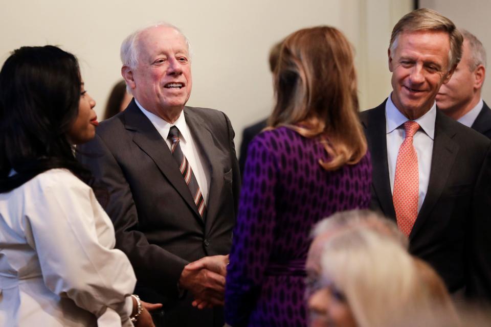 Former Democratic Gov. Phil Bredesen, second from left, and former Republican Gov. Bill Haslam, right, talk with audience members before a discussion on bipartisanship at Vanderbilt University Tuesday, Nov. 5, 2019, in Nashville, Tenn. (AP Photo/Mark Humphrey)