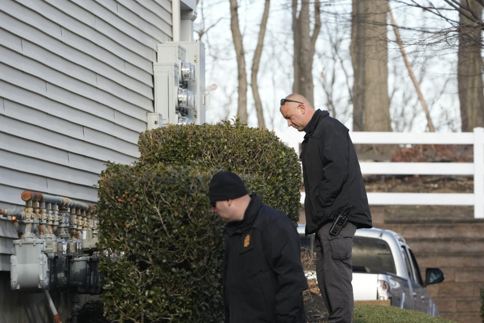 Police search near the home of Sayreville councilwoman Eunice Dwumfour in the Parlin area of Sayreville, N.J., Thursday, Feb. 2, 2023. Dwumfour was found shot to death in an SUV parked outside her home on Wednesday. According to the Middlesex County prosecutor's office, she had been shot multiple times and was pronounced dead at the scene. (AP Photo/Seth Wenig)