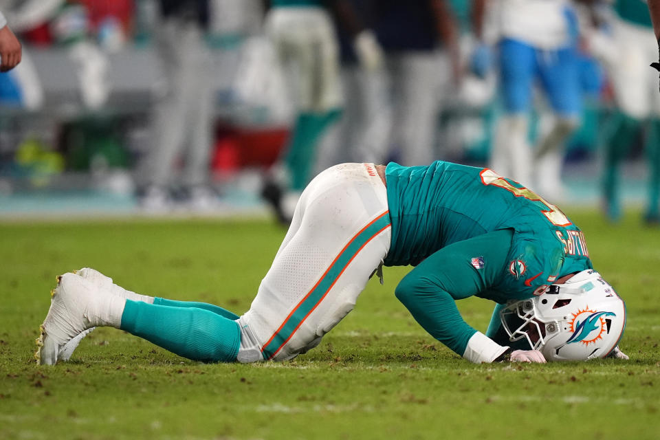 Sep 30, 2024; Miami Gardens, Florida, USA; Miami Dolphins linebacker Jaelan Phillips (15) reacts after an apparent injury during the second half against the Tennessee Titans at Hard Rock Stadium. Mandatory Credit: Jasen Vinlove-Imagn Images