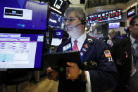 Trader John Panin works on the floor of the New York Stock Exchange, Tuesday, Oct. 8, 2019. Stocks are opening lower on Wall Street as tensions rose between Washington and Beijing just ahead of the latest round of trade talks. (AP Photo/Richard Drew)