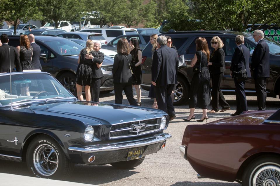 Mourners gather for funeral services for automobile executive Lee Iacocca at St. Hugo of the Hills in Bloomfield Hills, Mich., Wednesday, July 10, 2019. 