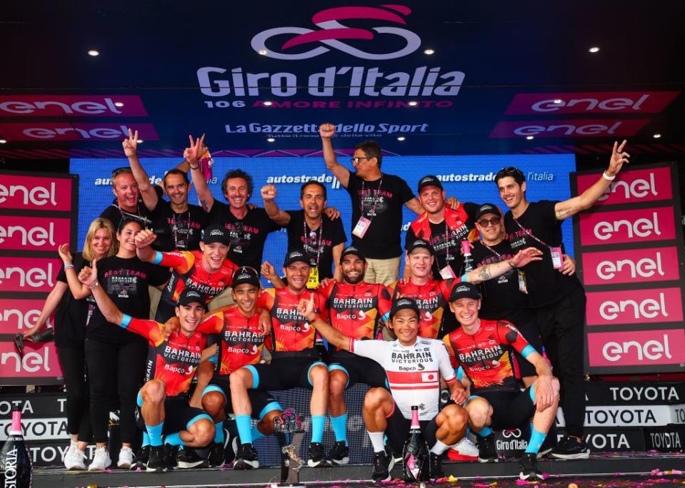 Bahrain  Victoriouss team members and staff celebrates winning the best team overall on the podium after the Giro dItalia 2023 cycling race in Rome on May 28 2023 Photo by Luca Bettini  AFP Photo by LUCA BETTINIAFP via Getty Images