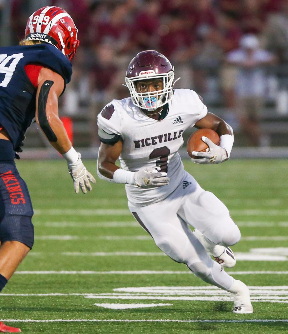 Eagles RB Micah Turner carries the ball as Niceville traveled to play Fort Walton Beach at Steve Riggs Stadium.