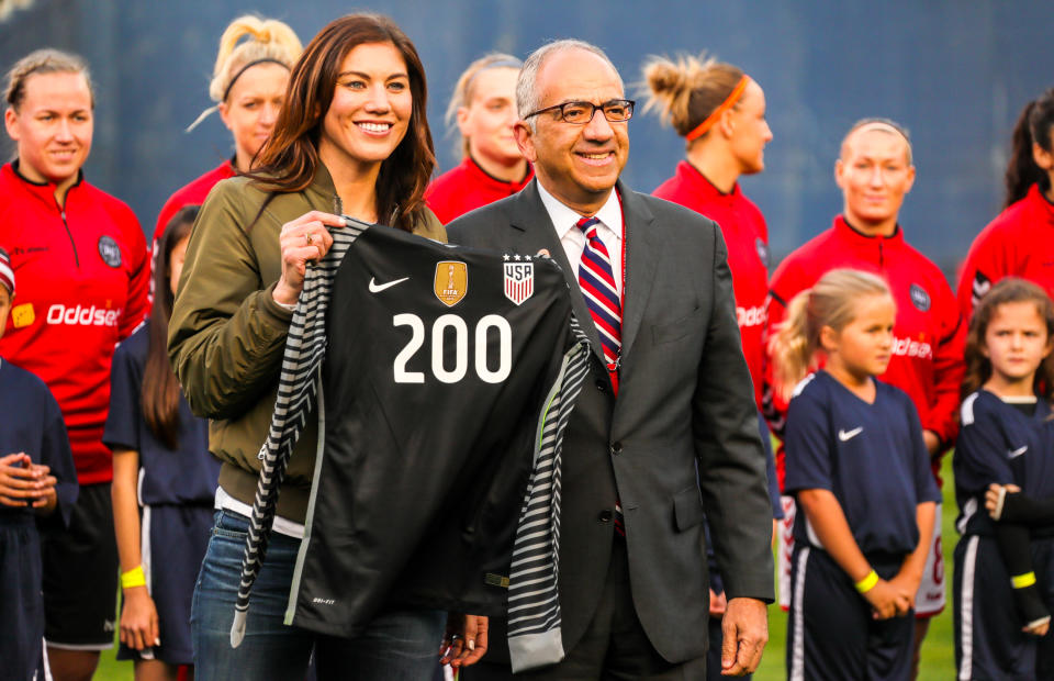 Carlos Cordeiro presented Hope Solo with a commemorative jersey last month. At Saturday’s U.S. Soccer election, Solo blasted him. (Getty)