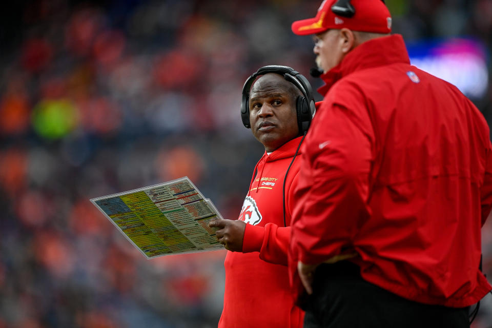 DENVER, COLORADO - JANUARY 08:  Offensive coordinator Eric Bieniemy and head coach Andy Reid of the Kansas City Chiefs look on during a game against the Denver Broncos at Empower Field at Mile High on January 8, 2022 in Denver, Colorado. (Photo by Dustin Bradford/Getty Images)