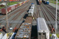 Railroad barge workers offload retired 1960s-era New York City R-32 subway cars at Greenville Yard in Jersey City, N.J., on Wednesday, June 15, 2022. From here, the old subway cars will travel by rail to an Ohio scrapyard as the MTA installs new R-179 train cars into the city's sprawling subway system. (AP Photo/Ted Shaffrey)