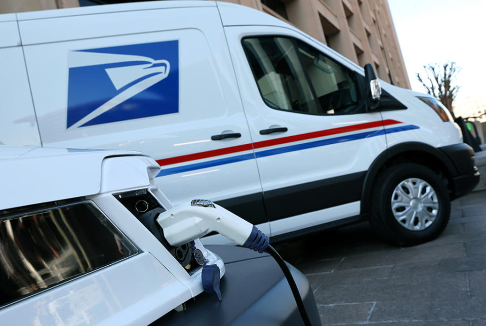 The United States Postal Service unveils two of its battery-powered vehicles at an event announcing its plan on implementing electric vehicles, at the Postal Service Headquarters on Dec. 20, 2022 in Washington, DC. - Credit: Getty Images