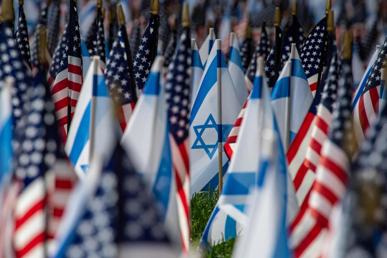 US and Israeli flags fill the field at Statler Park in Boston, Massachusetts, on Oct. 18, 2023. President Joe Biden delivered unequivocal US backing for Israel in person on Wednesday, supporting his ally's stance that Palestinian militants were behind a deadly rocket strike on a Gaza hospital that has inflamed anger across the Middle East and beyond.