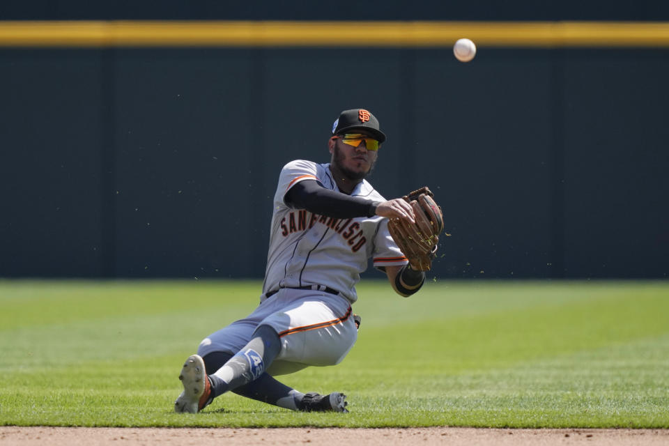 San Francisco Giants second baseman Thairo Estrada throws to first but is unable to get the out on Detroit Tigers' Riley Greene during the fourth inning of a baseball game, Saturday, April 15, 2023, in Detroit. (AP Photo/Carlos Osorio)